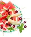 Top view of fresh fruits salad of melon, watermelon and cherries
