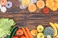 top view of fresh fruits with vegetables and assorted unhealthy food Royalty Free Stock Photo