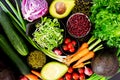 Top view Fresh fruits and vegetables,cucumber, cauliflower, avocado,red green bean,carrot, onion,tomato, on black paper.Full Royalty Free Stock Photo