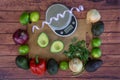 Top view of fresh guacamole ingredients with weight scale and measuring tape