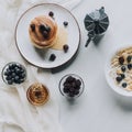 top view of fresh homemade pancakes with honey and berries coffee pot and muesli with milk Royalty Free Stock Photo