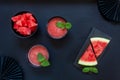 Top view of fresh iced homemade watermelon sorbet, granita, smoothie on black background Royalty Free Stock Photo