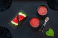 Top view of fresh iced homemade watermelon sorbet, granita, smoothie on black background Royalty Free Stock Photo