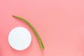 Top view of a fresh leaf of aloe vera and a white jar of cream on a pink background. Organic cosmetics with natural ingredients Royalty Free Stock Photo