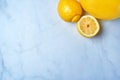 Top view of fresh lemons on kitchen marble. Antioxidant vitamin on white background