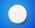 Top view of fresh milk glass on blue background. Breakfast drink Royalty Free Stock Photo