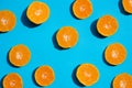 Top view fresh orange slices on bright blue background. . Copy Space. creative summer concept. Half of citrus in minimal, Banner