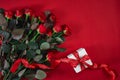 Top view fresh red rose flower and gift box on red deck with emp Royalty Free Stock Photo