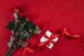 Top view fresh red rose flower and gift box on red deck with emp Royalty Free Stock Photo