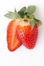 Top view of fresh red strawberries slice isolated on white background. Summer berries textured background. Flat lay. Macro shot of Royalty Free Stock Photo