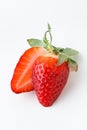 Top view of fresh red strawberries slice isolated on white background. Summer berries textured background. Flat lay. Macro shot of Royalty Free Stock Photo