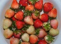 Top view of fresh red strawberries on white dish, Closeup of strawberries Royalty Free Stock Photo