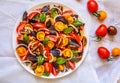 Top view of Fresh red & yellow cherry tomato salad and green and red basil leaves Royalty Free Stock Photo