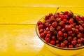 Top view of Fresh Ripe cherries in bowl on table background. Summer fruit. Healthy food concept. Copy space, top view Royalty Free Stock Photo