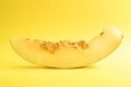 Top view of fresh ripe melon on yellow background. Minimal food concept. Creative food. Isolated on yellow