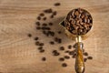 Top view of fresh roasted coffe beans in  cezve traditional turkish coffee pot on wooden table. Selective focus Royalty Free Stock Photo