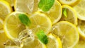 Top view of fresh sliced lemon, mint and ice rotation. Close up. Royalty Free Stock Photo