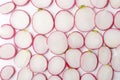 Top view of fresh sliced radishes as a background.Closeup of pieces of radishes