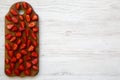 Top view, fresh strawberries on wooden board with copy space. White wooden table. From above, Royalty Free Stock Photo