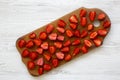 Top view, fresh strawberries on wooden board. White wooden surface. From above, Royalty Free Stock Photo