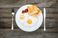 top view of fresh tasty breakfast with fried eggs and toasts on plate Royalty Free Stock Photo