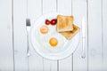 top view of fresh tasty breakfast with fried eggs and toasts on plate Royalty Free Stock Photo