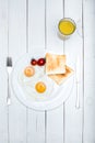 top view of fresh tasty breakfast with fried eggs and toasts Royalty Free Stock Photo