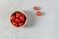 Top view fresh tomato slice and bowl on wood background. Royalty Free Stock Photo