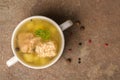 Top view of fresh transparent fish soup with sturgeon, potatoes