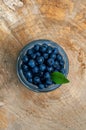 Top view of freshripe blueberries in glass jars on a rustic wood table Royalty Free Stock Photo