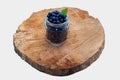 Top view of freshripe blueberries in glass jars on a rustic wooden stand. isolated Royalty Free Stock Photo