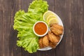 Top view fried chicken wings on wooden background