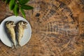 Top view fried mackerel on a white plate with real wooden table with copy space for text or design. Fried fish on the dish Royalty Free Stock Photo