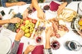 Top view of friend hands eating food and wine at barbecue garden Royalty Free Stock Photo