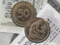 Top view of the front and back of a historic West Germany pfennig coin on a paper background