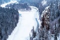 Frozen river in a snowy wooded canyon Royalty Free Stock Photo