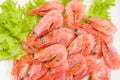 Top view of frozen shrimps on lettuce leaves