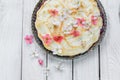 Top View on Fruit Pie with Flowers and Whipped Egg Whites Royalty Free Stock Photo