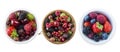 Top view. Fruits and berries in bowl isolated on white background. Ripe raspberries, cherries, strawberries, blackberries and blue