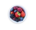 Top view. Fruits and berries in bowl isolated on white background. Ripe raspberries, strawberries, blackberries and blueberries. B