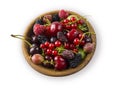 Top view. Fruits and berries in bowl on white background. Ripe currants, raspberries, cherries, strawberries, gooseberries, blackb Royalty Free Stock Photo