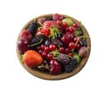 Top view. Fruits and berries in bowl on white background. Ripe currants, raspberries, cherries, strawberries, gooseberries, blackb Royalty Free Stock Photo