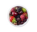 Top view. Fruits and berries in bowl on white background. Ripe currants, raspberries, cherries, strawberries, mulberries, gooseber Royalty Free Stock Photo