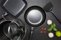 Top view frying pan and pot on black leather background Royalty Free Stock Photo