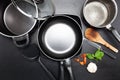 Top view frying pan and pot on black leather table image for coo Royalty Free Stock Photo