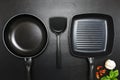 Top view frying pan and pot on black table Royalty Free Stock Photo