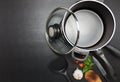 Top view frying pan and pot on black table. Royalty Free Stock Photo