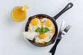 Top view of frying pan with three fried eggs Royalty Free Stock Photo