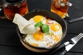 Top view of frying pan with three fried eggs Royalty Free Stock Photo