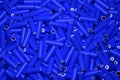 Top view full frame background of many 18650 lithium blue batteries chaotically arranged.
